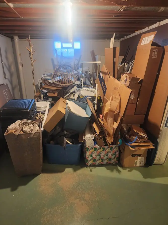 Roll-off dumpster container at job site for 2 Yard Dumpster Rental in Romulus